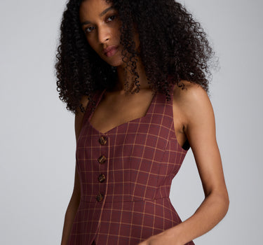 Chaleco peplum de corte curvo con cuatro botones para mujer