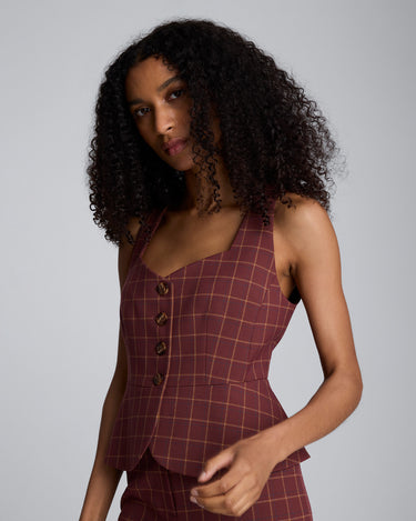 Chaleco peplum de corte curvo con cuatro botones para mujer