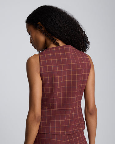 Chaleco peplum de corte curvo con cuatro botones para mujer