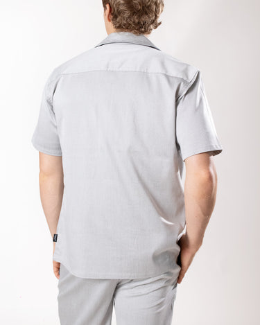 Camisa manga corta con bolsillo regular fit para hombre